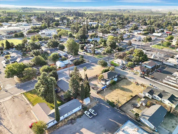 an aerial view of residential houses with outdoor space