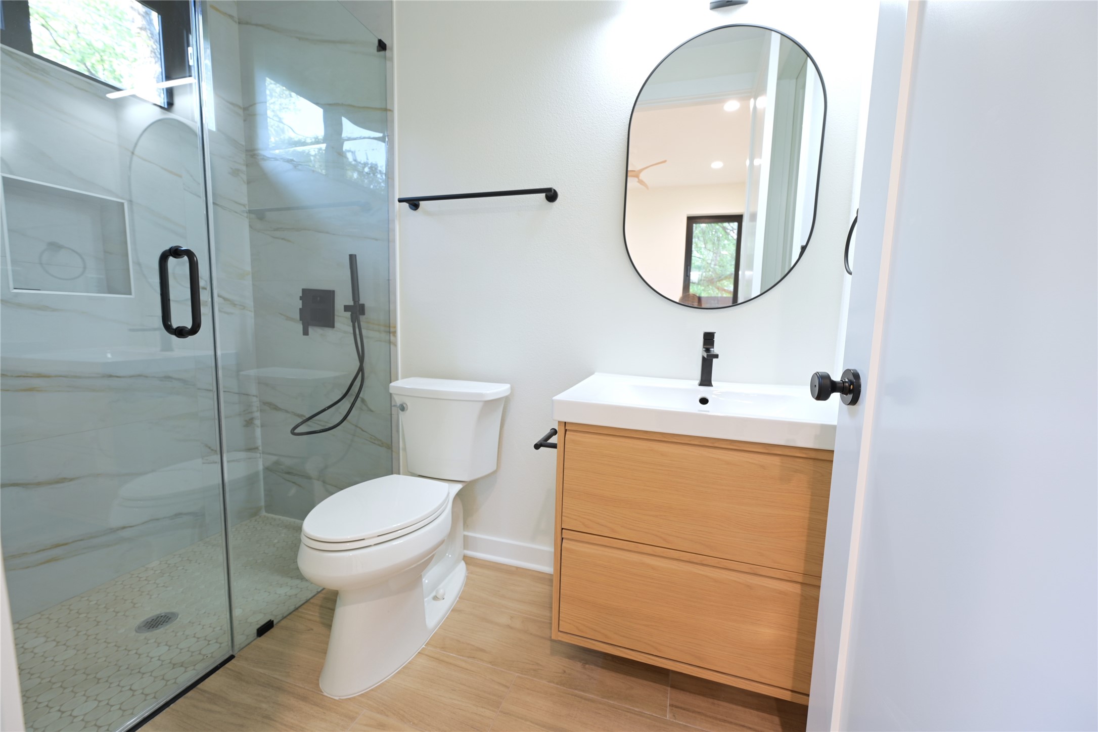 4410 Glomar Avenue, Unit 2 Austin, TX 78721 - Photo 12 of 24 Full bath with access from bedroom and living area