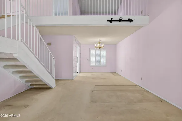 a view of a livingroom with a staircase
