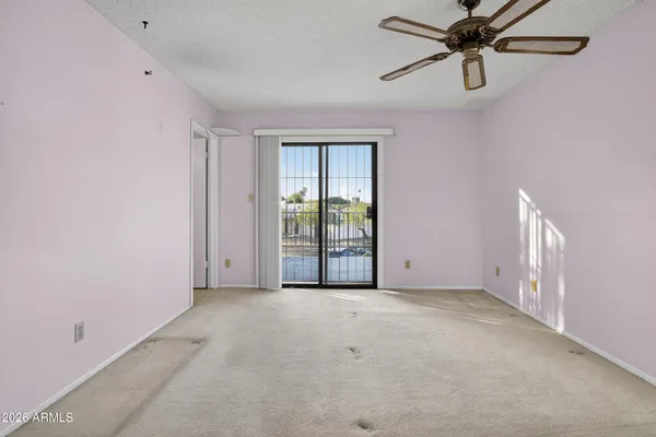 a view of an empty room with a window
