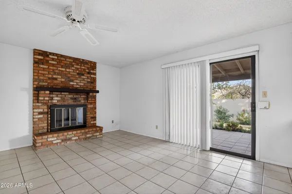 a view of an empty room with glass door