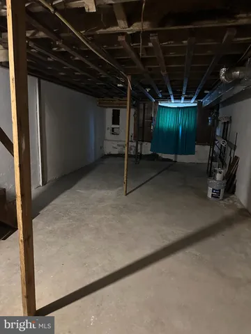 a view of a room with wooden walls