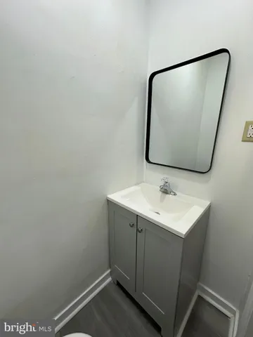 a bathroom with a sink and mirror