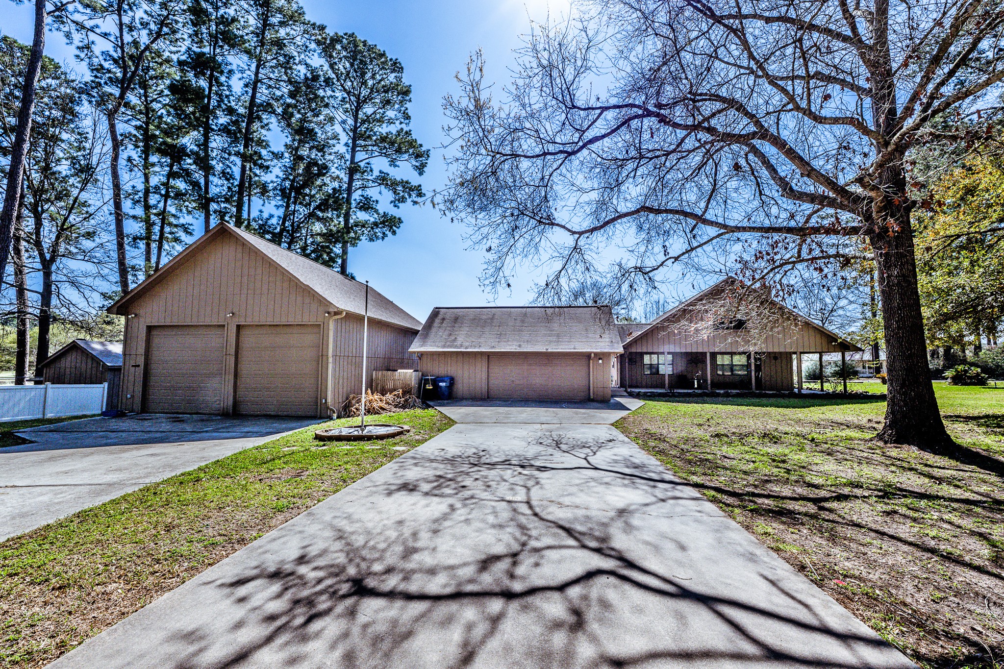 191 Timber Bay Drive Trinity, TX 75862 - Photo 1 of 48 Side view of home showing both garages.