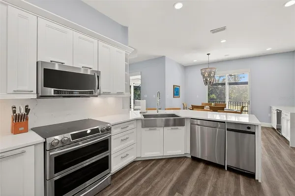 a spacious bathroom with a double vanity sink a mirror and a shower