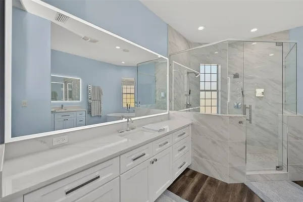 a bathroom with a window and a shower