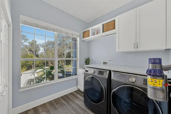 a kitchen with stainless steel appliances a stove a refrigerator and cabinets