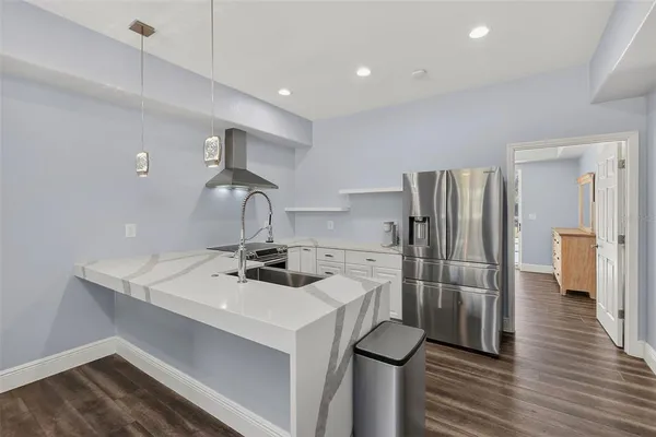 a view of a swimming pool with an outdoor space and seating area