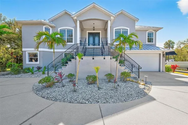 a living room with furniture a fireplace and a large window