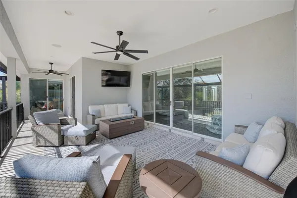 a living room with fireplace furniture and a wooden floor