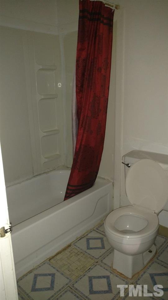 4272 Lake Ridge Drive Raleigh, NC 27604 - Photo 11 of 13 a bathroom with a toilet and a shower