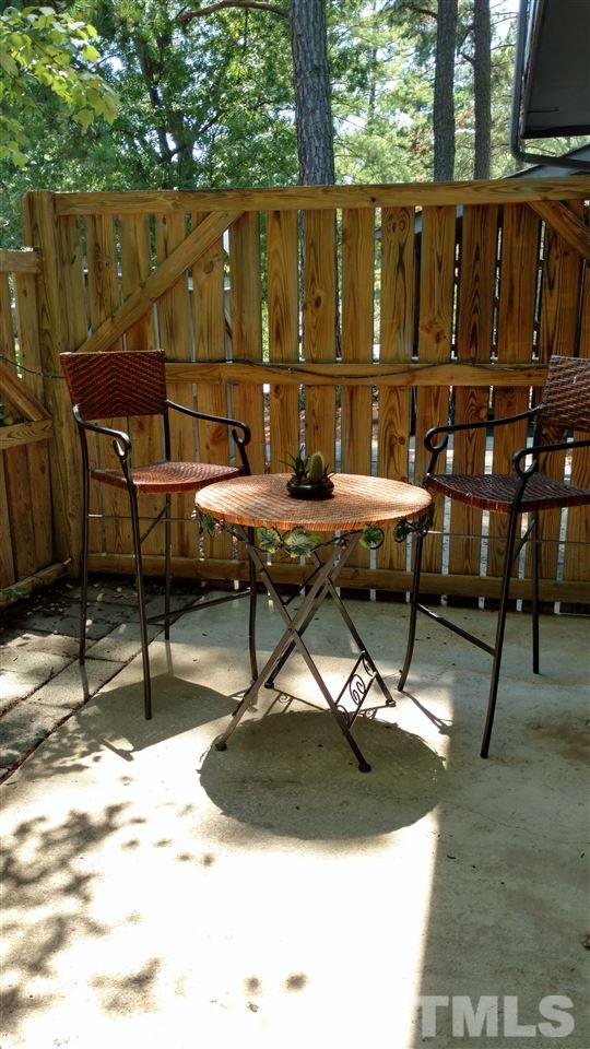 4272 Lake Ridge Drive Raleigh, NC 27604 - Photo 3 of 13 a roof deck with table and chairs