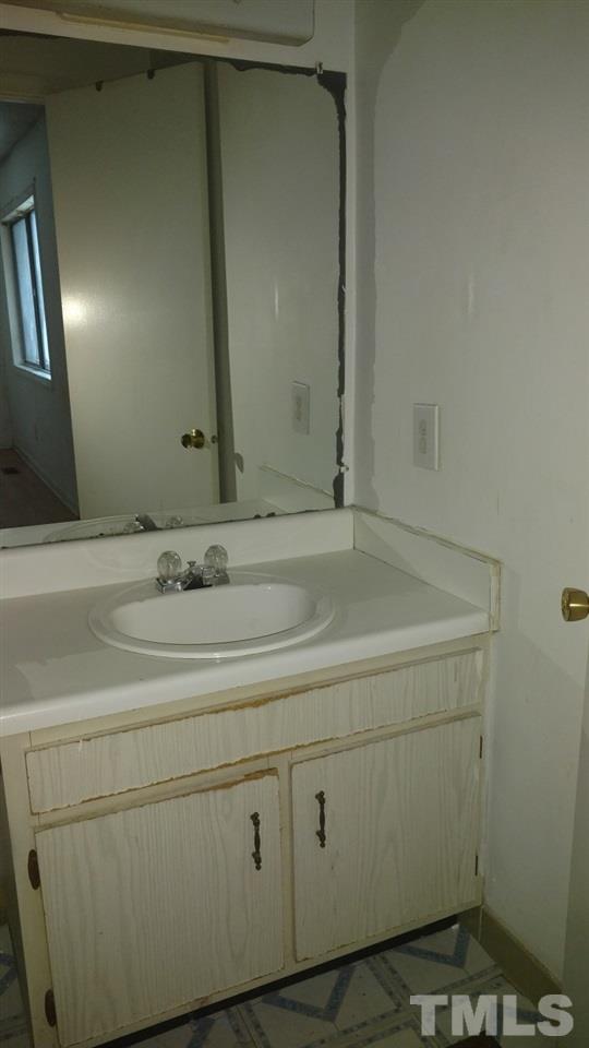 4272 Lake Ridge Drive Raleigh, NC 27604 - Photo 6 of 13 a bathroom with a sink and mirror