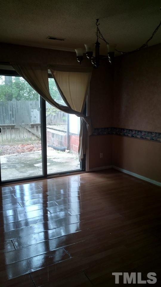 4272 Lake Ridge Drive Raleigh, NC 27604 - Photo 7 of 13 a view of empty room with wooden floor