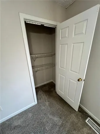 a white toilet sitting next to a bathroom sink and a sink