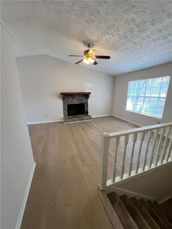 an entryway with a window and a fireplace