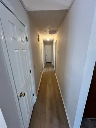 a view of a room with racks on the wall