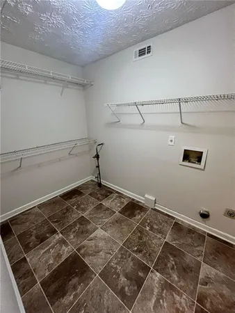 a view of a room with a wooden floor