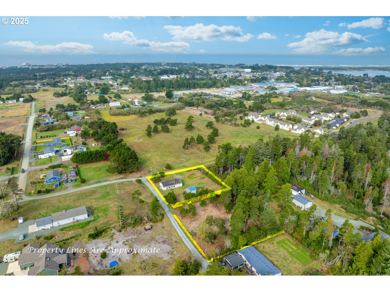 87905 Astor Lane Bandon, OR 97411 - Photo 23 of 26 a view of a city with mountains in the background