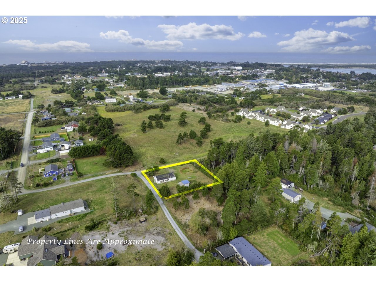 87905 Astor Lane Bandon, OR 97411 - Photo 4 of 26 an aerial view of residential house with outdoor space and mountain view