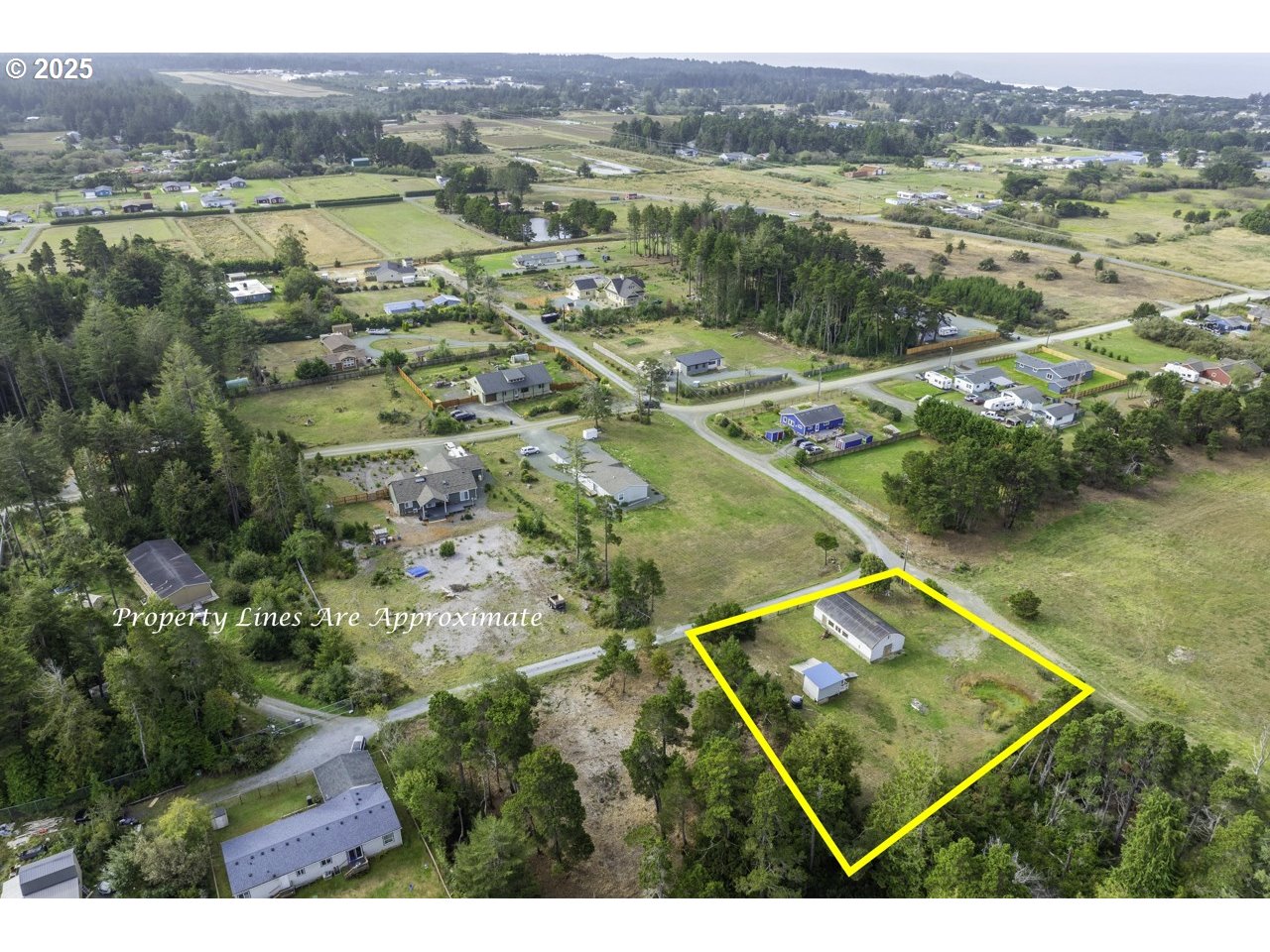 87905 Astor Lane Bandon, OR 97411 - Photo 5 of 26 a view of a lake with a mountain