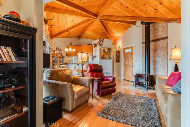 a living room with furniture a red lamp and a fireplace