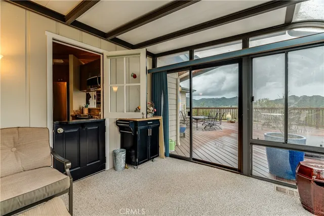 a bedroom with a bed and glass window