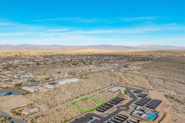 front view of a brick house with a yard