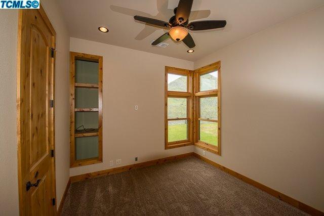 41167 Oak Ridge Drive Three Rivers, CA 93271 - Photo 19 of 27 an empty room with windows and fan
