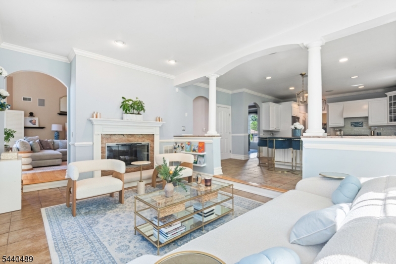 99 East Lindsley Road Cedar Grove, NJ 07009 - Photo 12 of 41 a living room with furniture and a fireplace