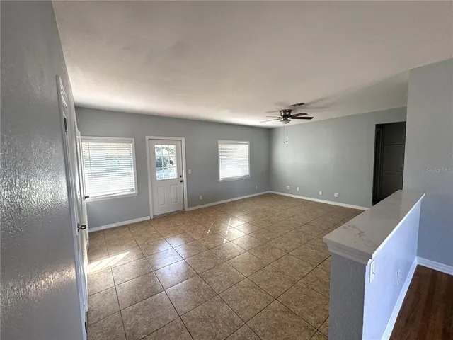 a view of an empty room and window