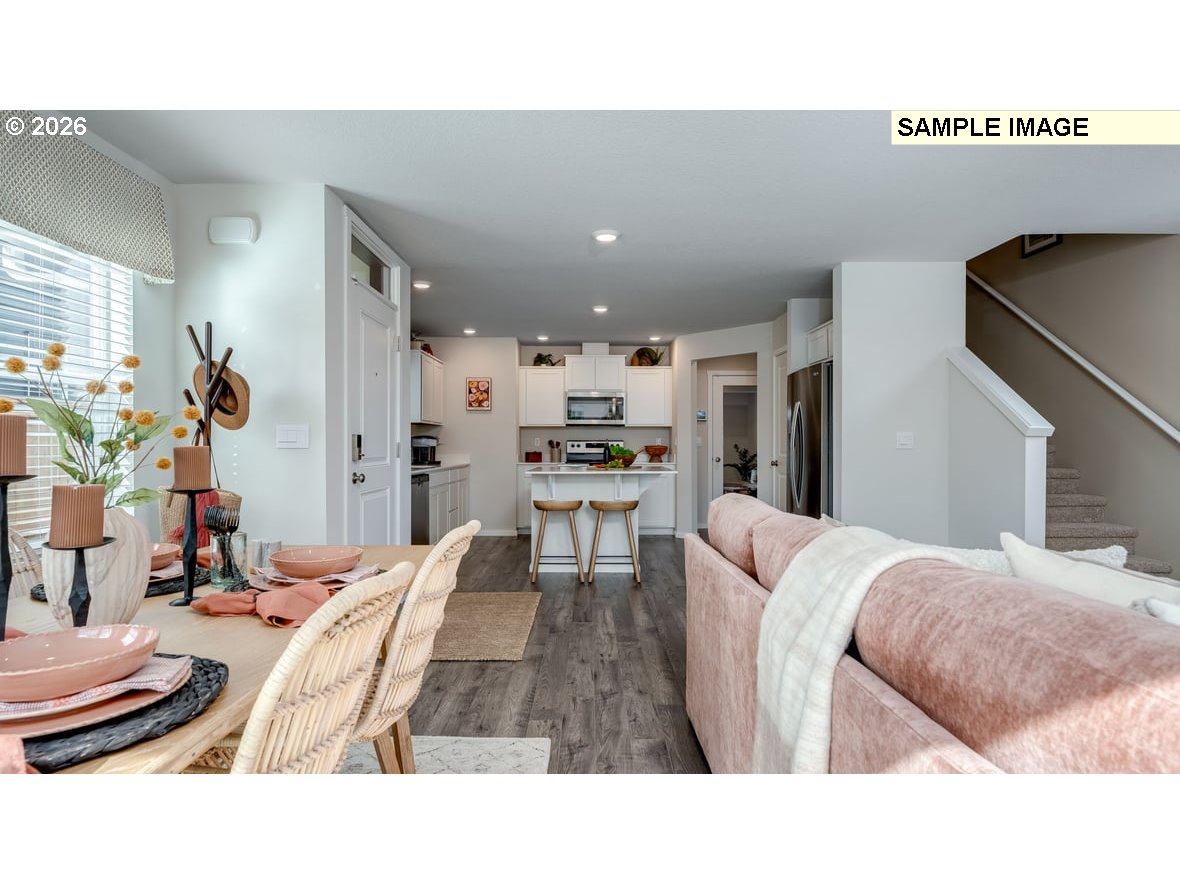 105 Coho Loop Woodland, WA 98674 - Photo 12 of 27 a living room with stainless steel appliances kitchen island granite countertop furniture and a dining table