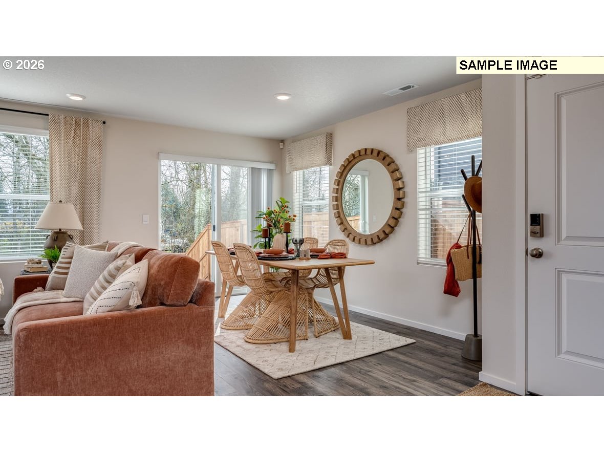 105 Coho Loop Woodland, WA 98674 - Photo 8 of 27 a living room with furniture a window and a clock