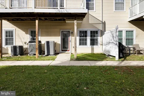 a view of a building with a yard