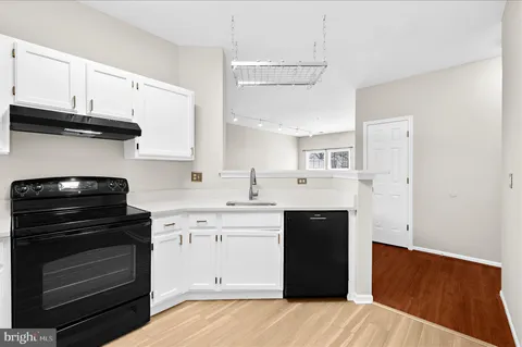 a view of a kitchen with electric appliances