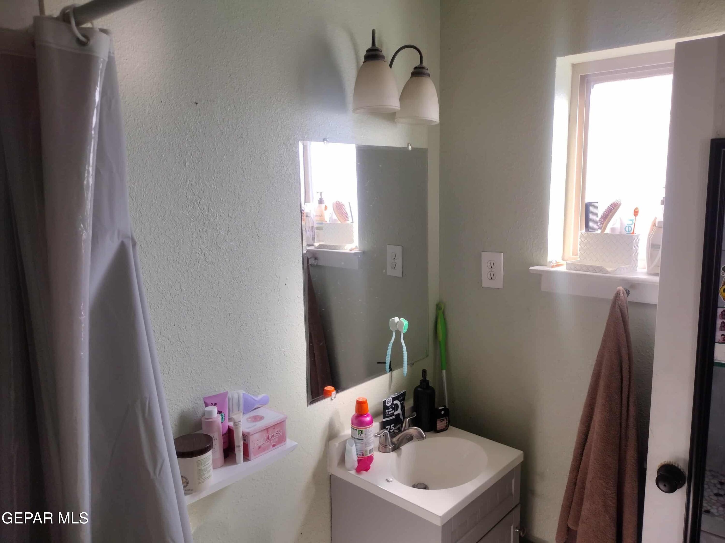 3307 Donegal Road El Paso, TX 79925 - Photo 13 of 21 a bathroom with a sink toilet and vanity