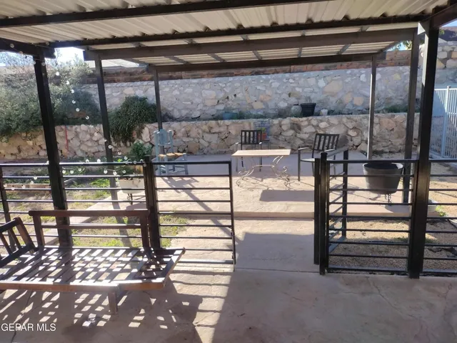 a view of water heater room with wooden floor