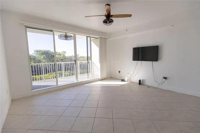 a view of an empty room with a flat screen tv