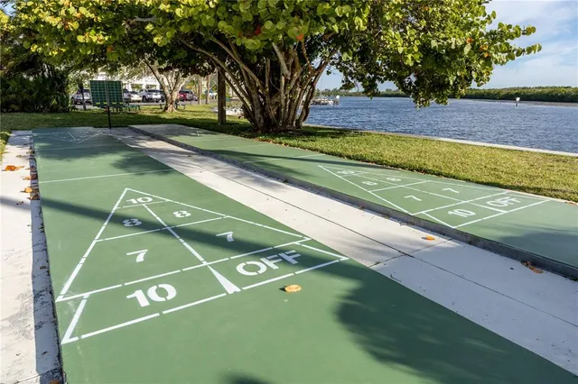 a balcony with table and chairs