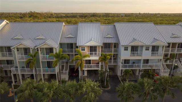 a aerial view of a house with a lake view