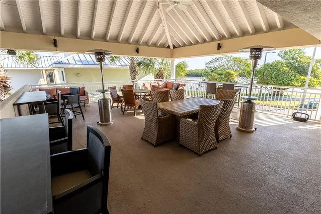 a view of balcony with wooden floor and fence