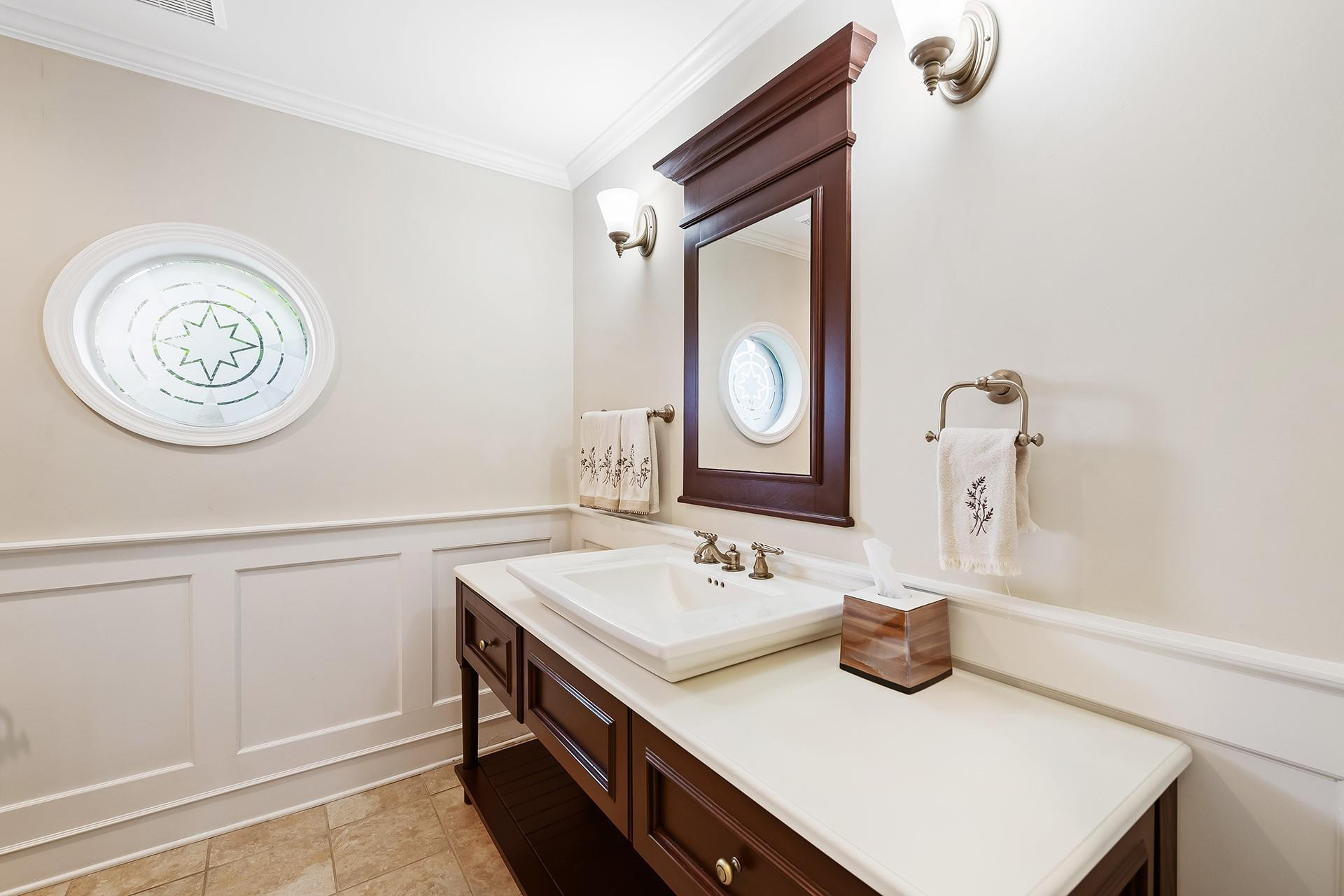 10344 Sunset Bend Drive Boca Raton, FL 33428 - Photo 19 of 32 a bathroom with a sink and a mirror