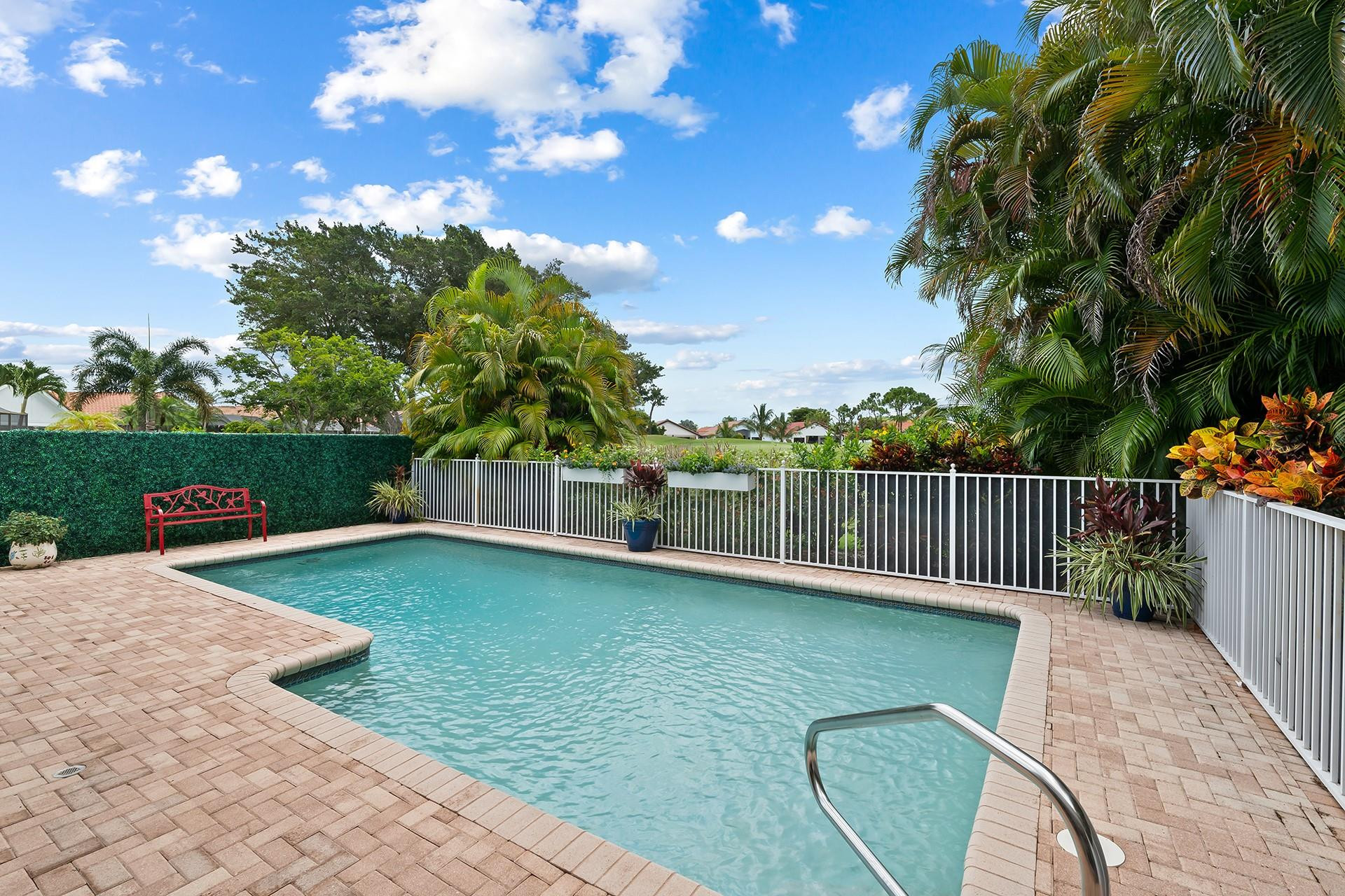 10344 Sunset Bend Drive Boca Raton, FL 33428 - Photo 24 of 32 a view of a backyard with swimming pool