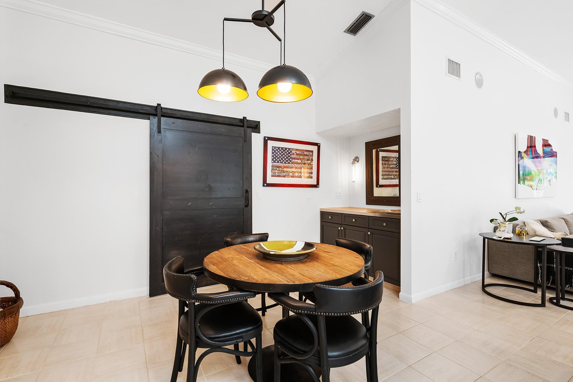 10344 Sunset Bend Drive Boca Raton, FL 33428 - Photo 10 of 32 a view of a dining room with furniture and a chandelier