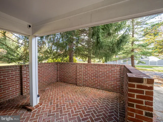 a view of a hallway with seating area