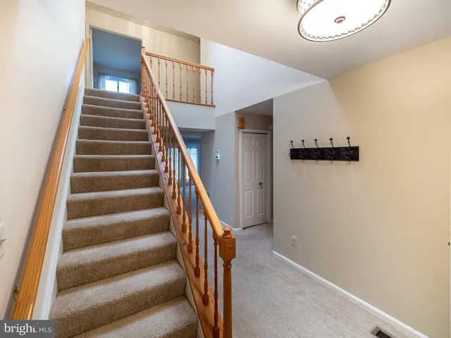 a view of empty room with a fireplace
