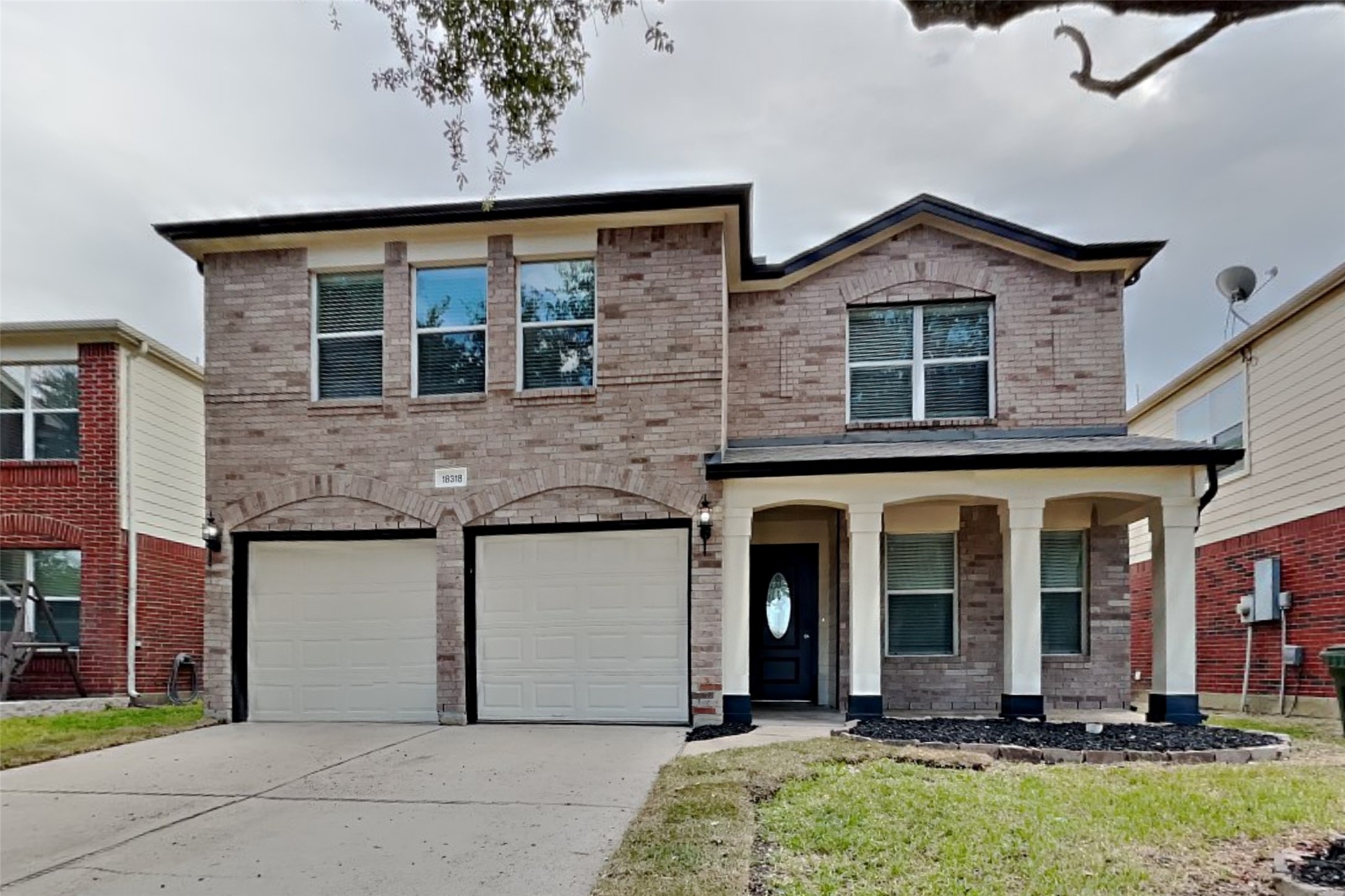 front view of a house with a yard
