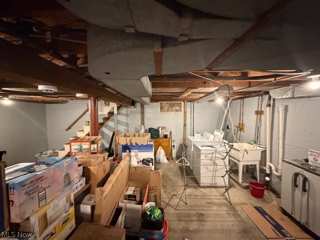 35180 Solon Road Solon, OH 44139 - Photo 26 of 33 Unfinished basement featuring stairway and independent washer and dryer