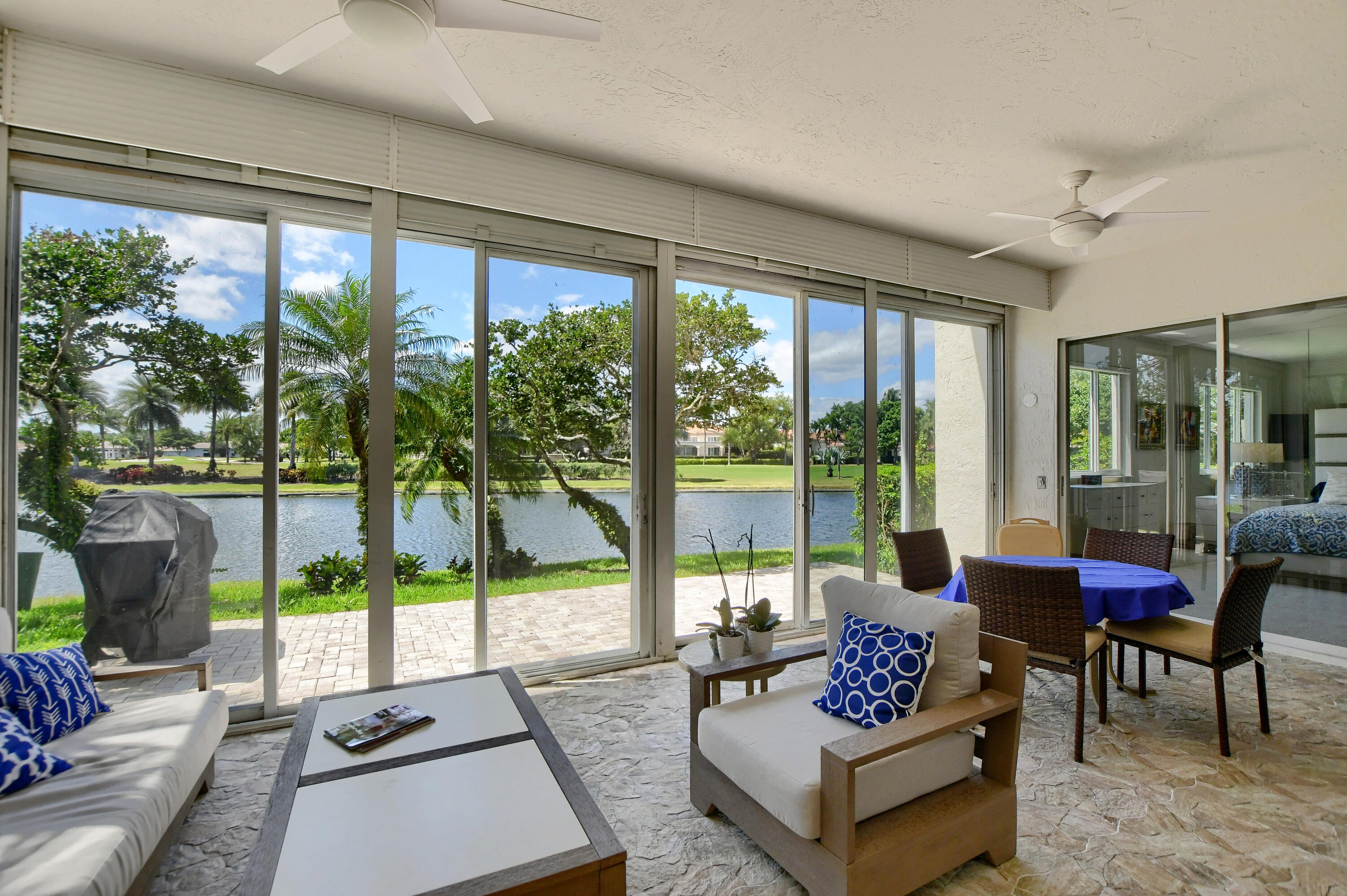 2461 Northwest 59th Street, Unit 701 Boca Raton, FL 33496 - Photo 31 of 62 GLASSED-SCREENED-IN PATIO / LAKE VIEWS