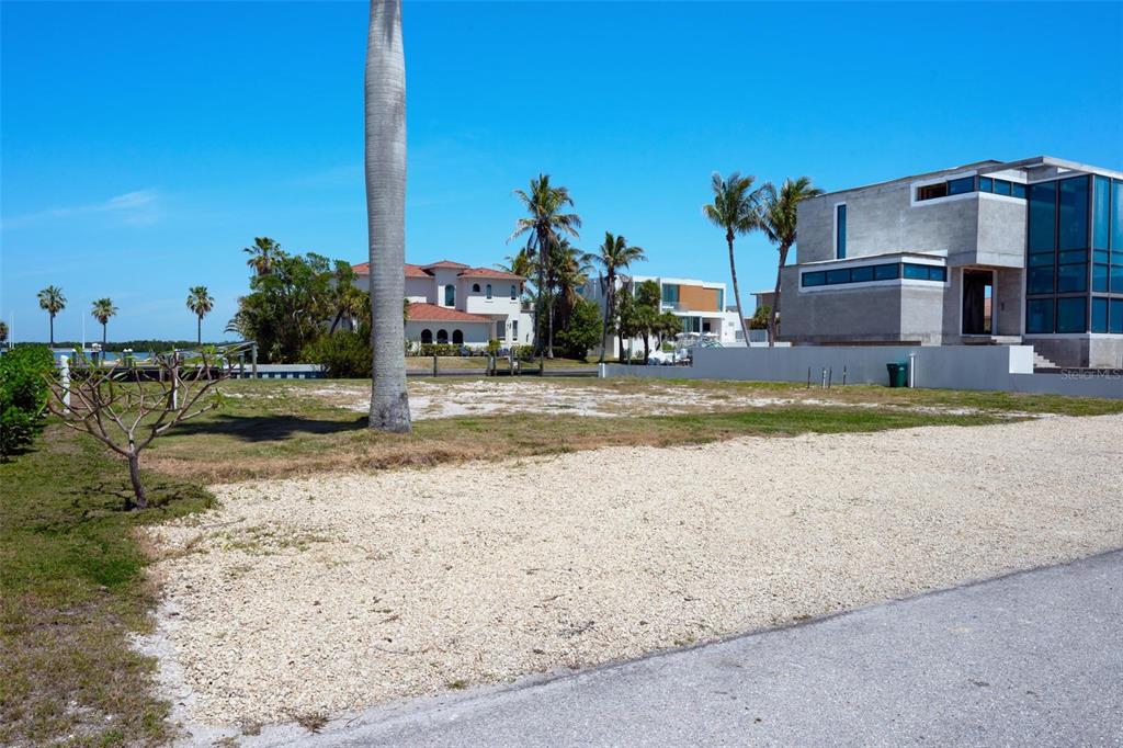 581 Rountree Drive Longboat Key, FL 34228 - Photo 15 of 50 a view of a house with a patio